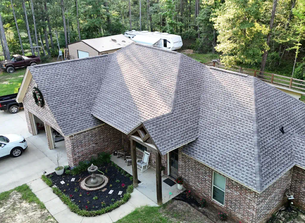 residential property with a newly installed shingle roof